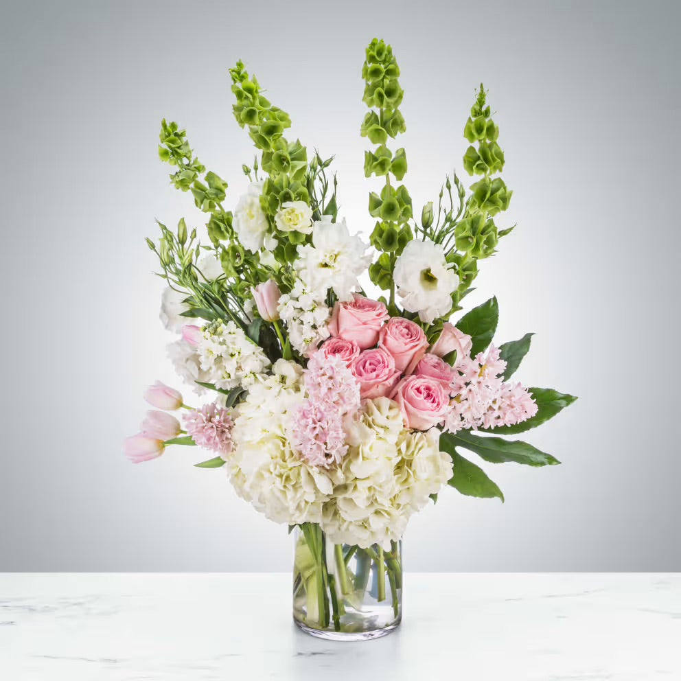 A glamorous bouquet of pink-hued flowers, exuding elegance and charm.